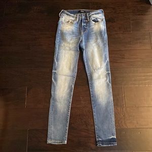 Slightly distressed jeans that could still be worn to work and school